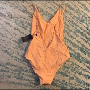 Beautiful orange 🍊 one piece swimsuit. Never worn